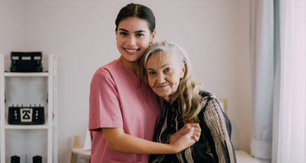 caregiver hugging her patient